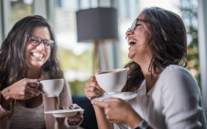 Calm relaxed attractive women with eyes closed enjoying BrewLaLa Protein Coffee or Hot Chocolate.